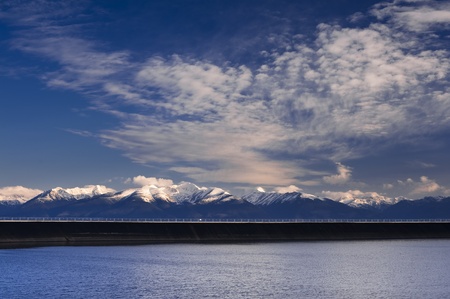 Early morning on dam reservoir in mountainsの写真素材