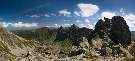 Mountain ridge scenery in sunny summer day panoramaの写真素材