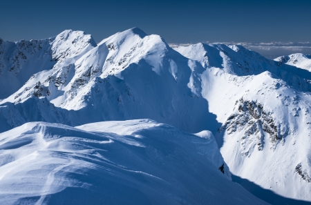 Mountains winter scenery in white and blueの写真素材