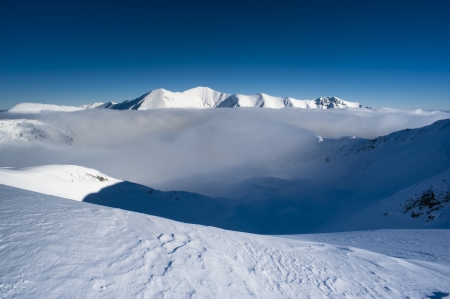 Mountains winter scenery in white and blueの写真素材