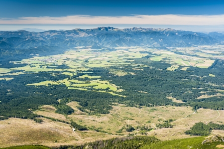A huge valley with villages and forestsの写真素材