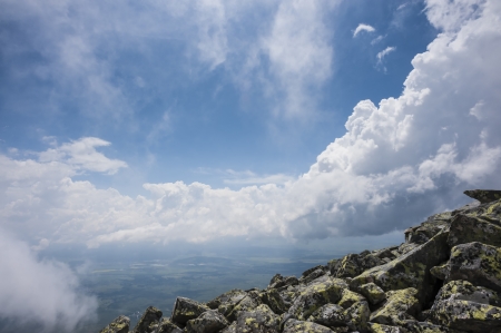 A storm is coming in summer mountains, with blue sky and cloudsの写真素材