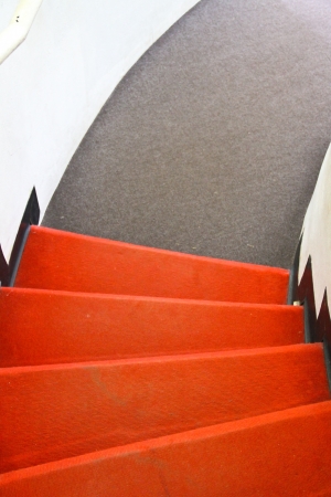 Red and gray carpet on stairの写真素材