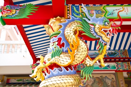 Dragon sculpture rounded the red columnの写真素材