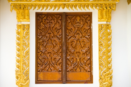 Art on window thai temple, Wat Prathatnongbua at Ubonratchathani Province Thailandの写真素材