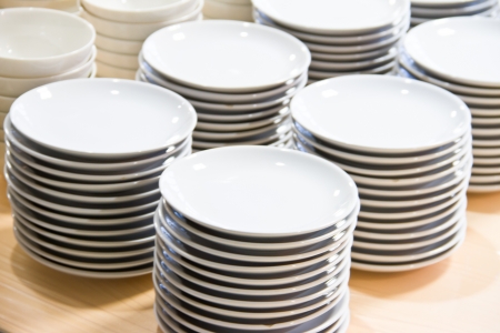 Stacked white dishesの写真素材