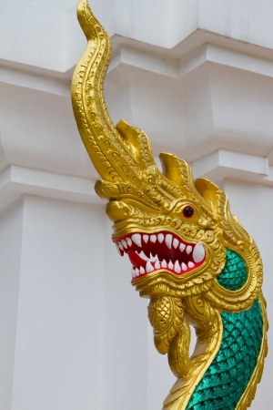 king of naga with blue sky at thai templeの写真素材