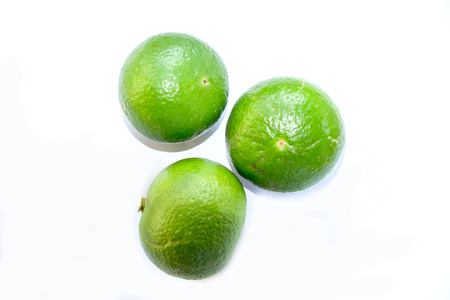 Green lemon isolate on white backgroundの写真素材
