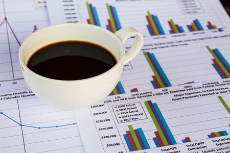 Business report with cup coffeeの写真素材
