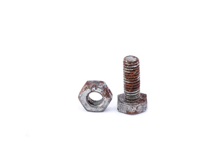 Rusty nut and bolt isolated on white の写真素材