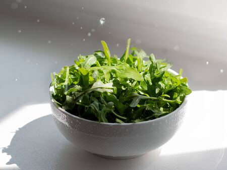 bowl of salad greens fresh and healthyの写真素材