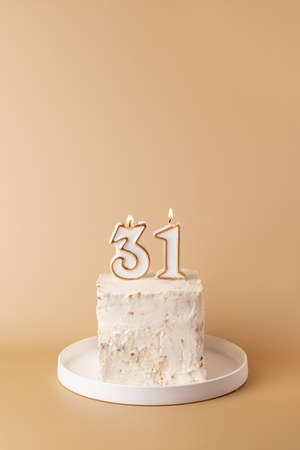 Cake with candles for celebration of the thirty first birthdayの写真素材