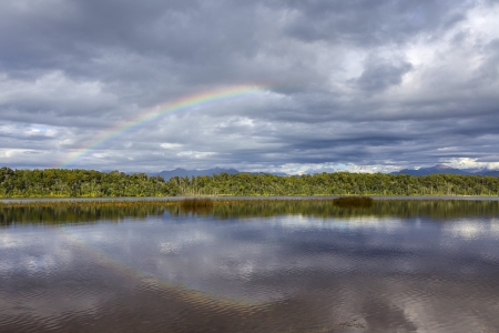 Rainbow at Lake Mahinapua in New Zealandの写真素材