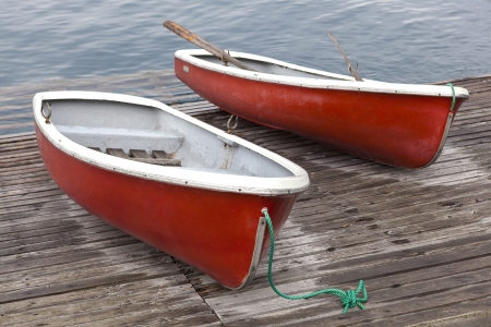 Two red rowboat on wood bridgeの写真素材