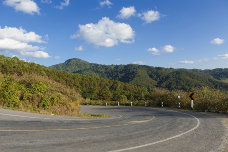 Asphalt road sharp curve on the mountainの写真素材