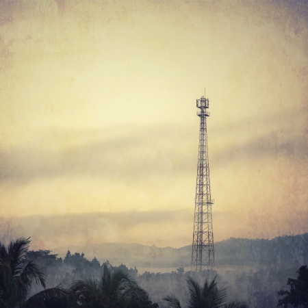 Vintage style telecom tower in the morning mistの写真素材
