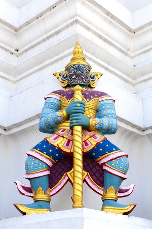 Giant statue with pagoda in temple of Thailandの写真素材