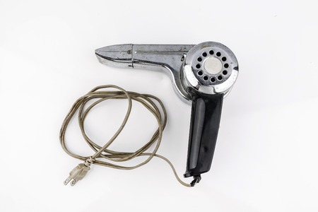 Old hairdryer on the white backgroundの写真素材