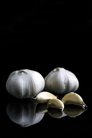 garlic on black backgroundの写真素材