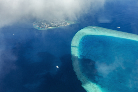 Aerial View from seaplane over Atolls at Indien Ocean, Maldivesの写真素材