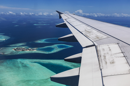 Arplane fly over Atolls in Indien Oceanの写真素材