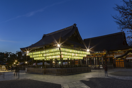 KYOTO, JAPAN - NOV 20, 2015: Unidentified tourists sightseeing Japanese paper lanterns illumination at the Buden Hall in Yasaka Shrine one of most famous shrines in Kyoto. Founded over 1350 years agoのeditorial素材