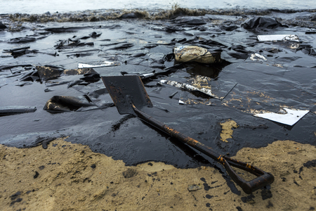 Crude oil on oil spill is accident on a beach at Ao Prao Beach, Koh Samet, Rayong, Thailandの写真素材