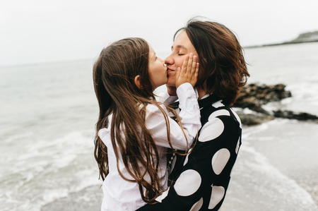 portraits of mom and daughter on the  sea beachの写真素材