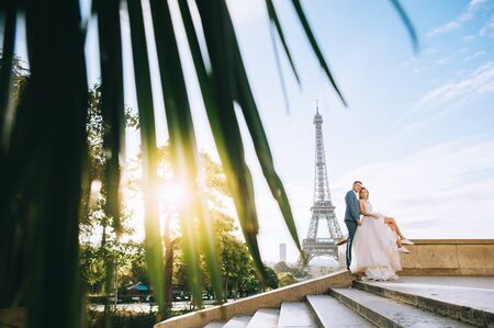 Happy bride and groom enjoying their wedding in Parisの写真素材
