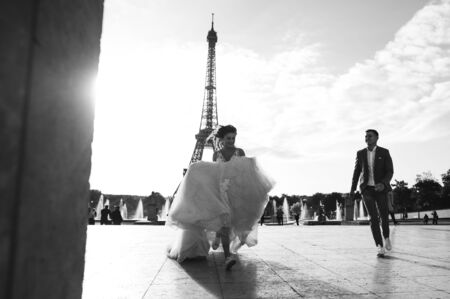 Happy bride and groom enjoying their wedding in Parisの写真素材