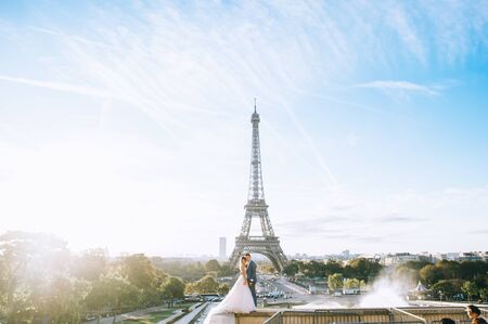 Happy bride and groom enjoying their wedding in Parisの写真素材