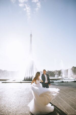 Happy bride and groom enjoying their wedding in Parisの写真素材