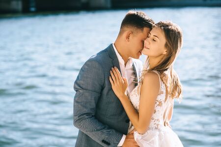 Happy bride and groom enjoying their wedding in Parisの写真素材