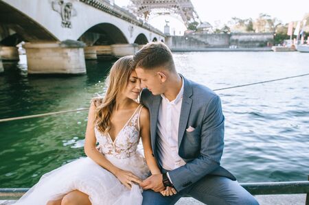 Happy bride and groom enjoying their wedding in Parisの写真素材