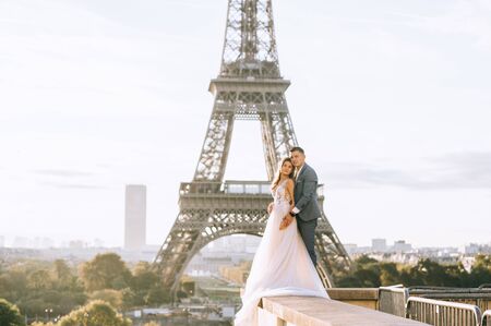 Happy bride and groom enjoying their wedding in Parisの写真素材