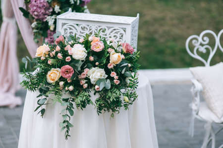 Floral details of wedding ceremony outdoors. Close up of floral bouquets and compositions.の写真素材