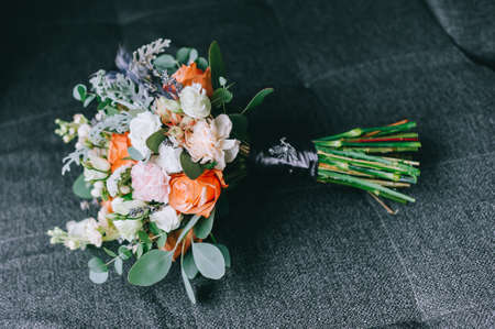 Elegant delicate bouquet of the bride made of white peonies, hydrangeas, roses and green branches.の写真素材