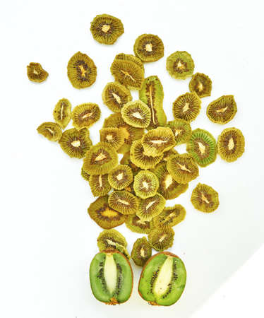 Fresh kiwi and dried kiwi slices on white background.の写真素材