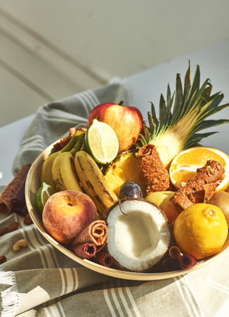 Fresh fruits in a plate on the table.