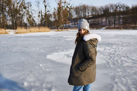 A portrait of beautiful caucasian girl in glases outdoor in snowy winter.の写真素材