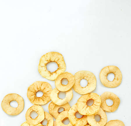 Fruit chips from apples on a white background.の写真素材