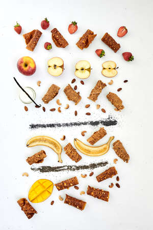 Flat lay of various dried and fresh fruits on a white background. Fruits, pastilles and fruit chips in creative background.の写真素材