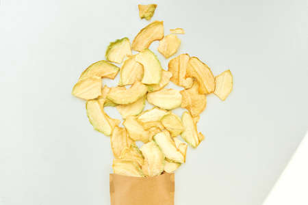 Fruit chips with melon on a white background.の写真素材