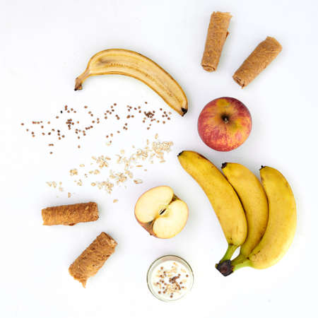 Flat lay of various dried and fresh fruits on a white background. Fruits, pastilles and fruit chips in creative background.の写真素材