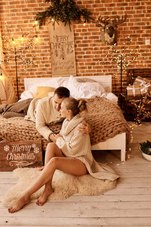 happy family mother father and child on Christmas morning in bedroom playing and have a funの写真素材