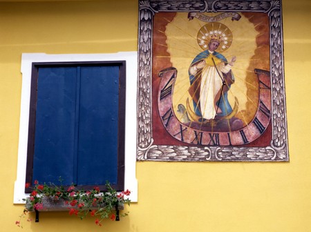 Window and Sun clock in Bavariaの写真素材
