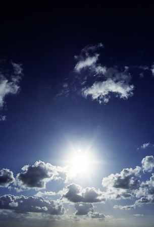 Sky with sun and cloudsの写真素材