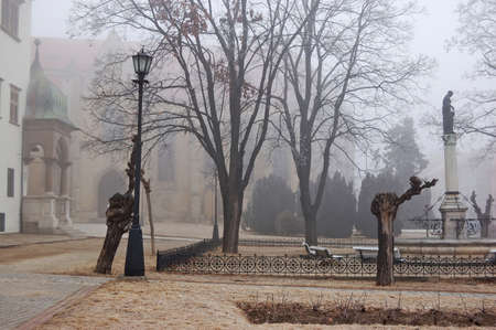 Misty Old Town Hall and Church in Medieval Levoca , Slovakiaの写真素材