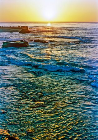 Watching sunset on pier in La Jolla, Californiaの写真素材