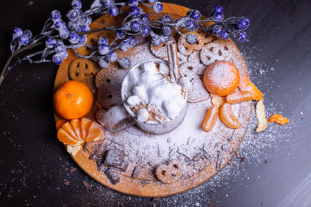 A mug of cocoa with cream and cinnamon stick marshmallowの写真素材